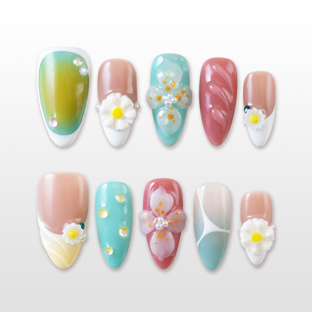 Green to yellow ombre press-on nails with 3D daisy and pastel floral accents