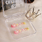 Cute kawaii nails with My Melody charm, floral patterns, and soft yellow tips