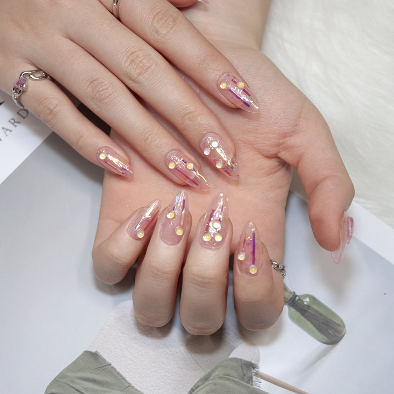 Kawaii press-on nails with star charm, holographic glitter, and pastel pink jelly look