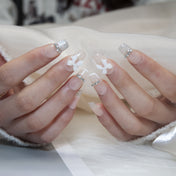 Luxury cream press-on nails with silver rhinestones and 3D sculpted bow