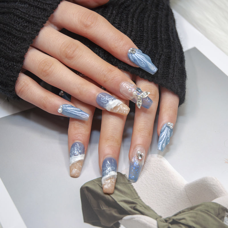 Summer vacation nails featuring blue sky, seagulls, and tropical beach design