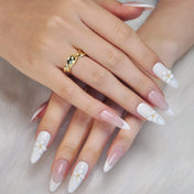 Elegant almond-shaped press-on nails with nude base and 3D white blossoms