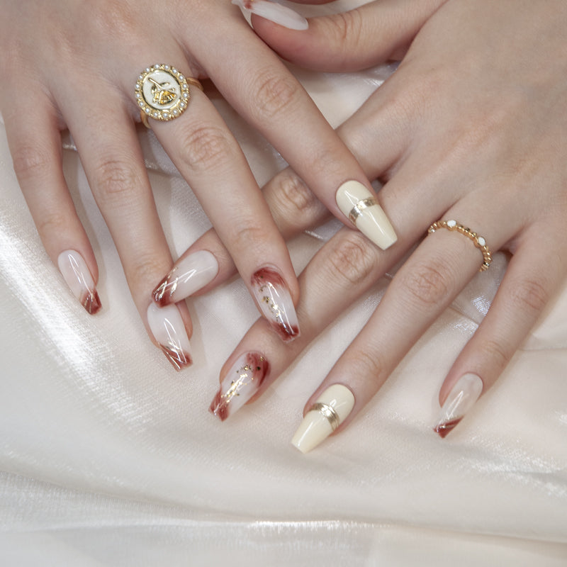 Handmade ombre nails in white and mocha brown with metallic gold details