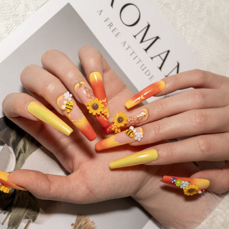 3D sunflower nails with honeycomb and daisy accents