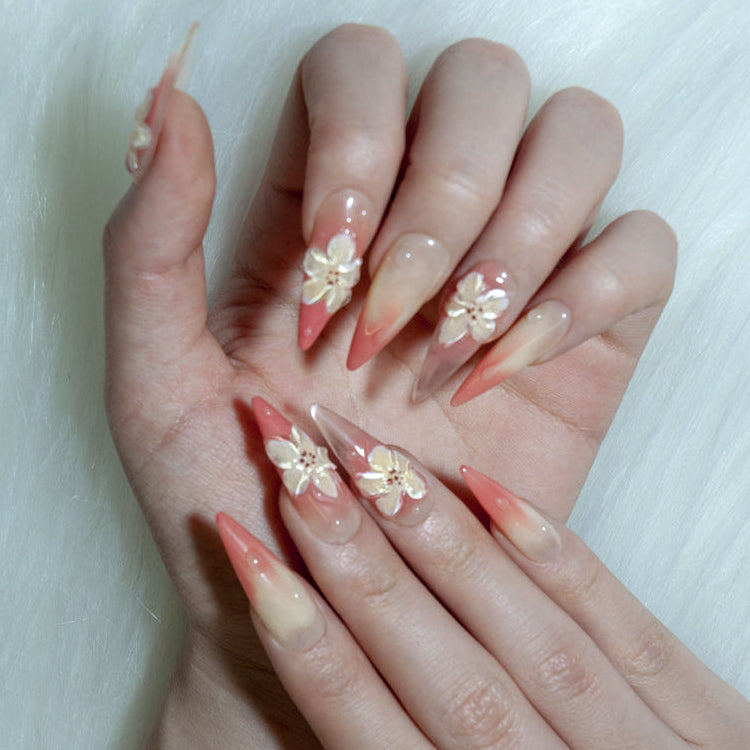 Handmade gradient nails in coral and cream with delicate 3D flowers
