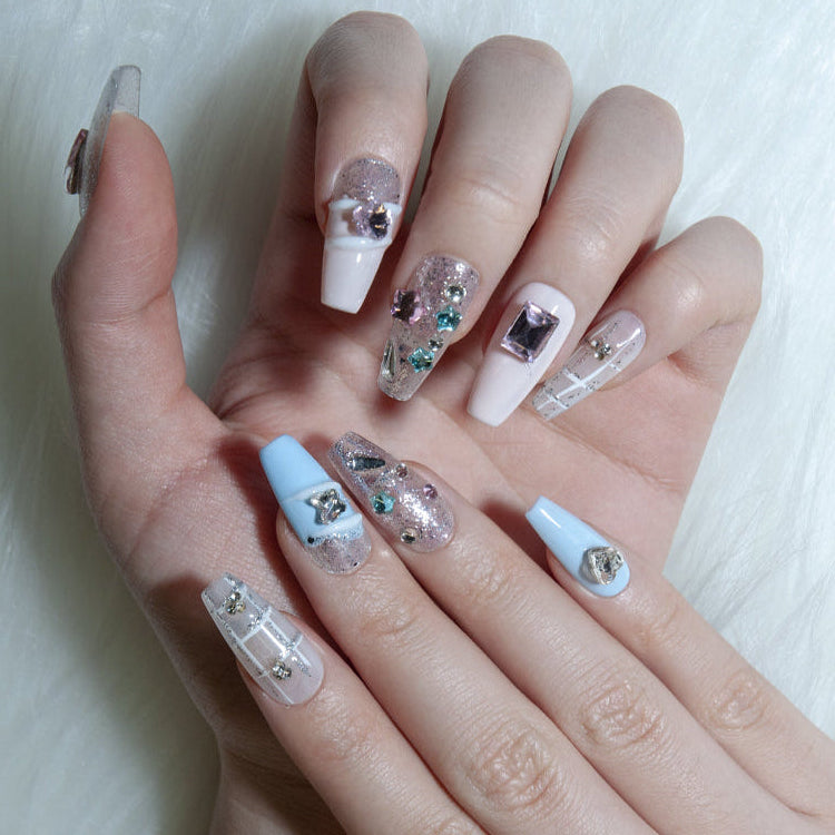 Blue gradient nails with metallic heart charm and silver sparkle design