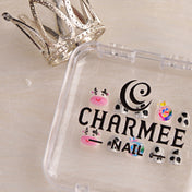 Handmade glitter nails with black cow spots, kawaii cow charm, and colorful lollipop