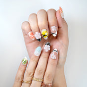 Trendy floral press-on nails in pop art style with vibrant gradients