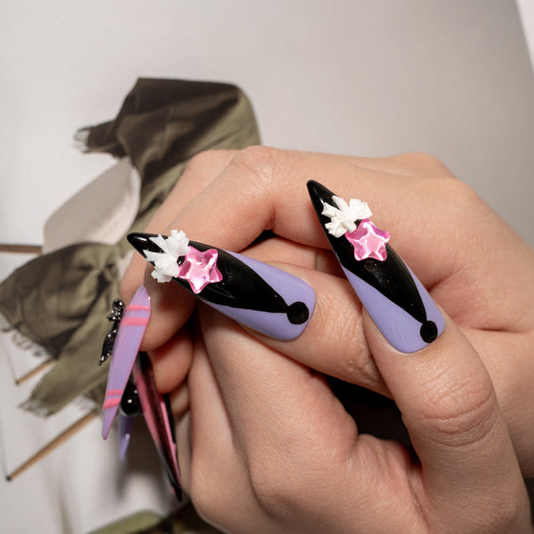 Gothic kawaii press-on nails with Kuromi, heart skulls, and sparkly star embellishments