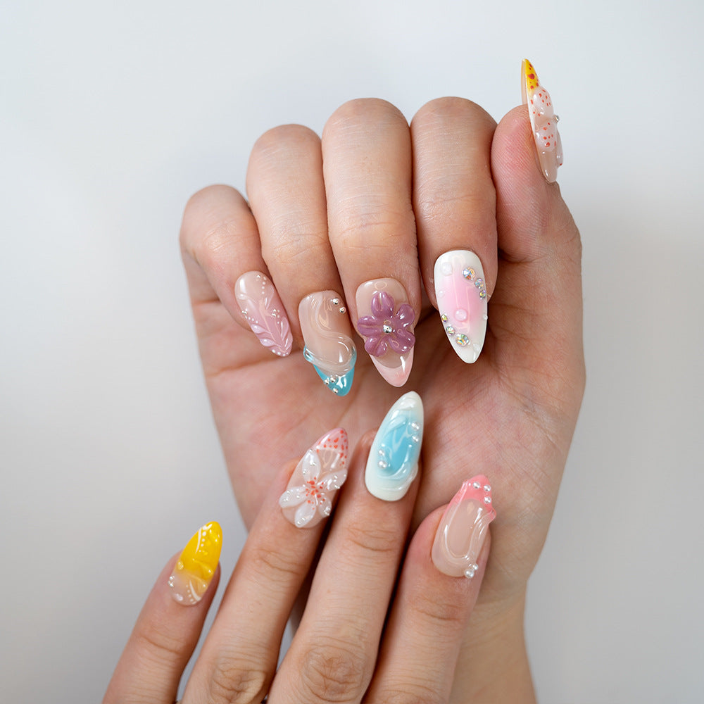 Medium almond press-on nails with 3D floral design and summer vibes