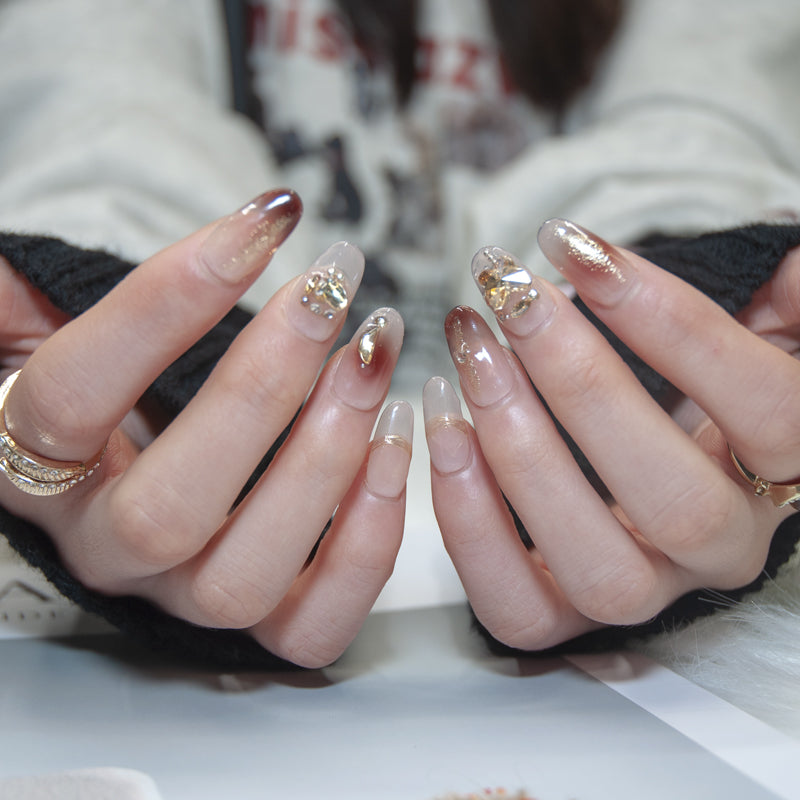 Luxury handmade ombre press-on nails with gold heart gem and crystal embellishments