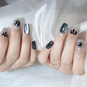 Edgy black press-on nails with silver shimmer and marble swirl