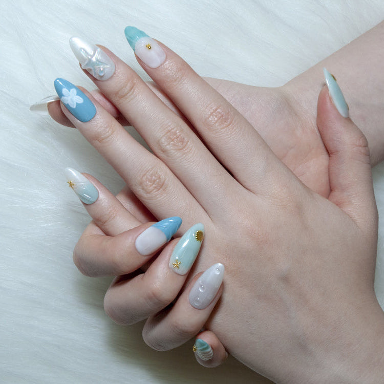 Summer vacation press-on nails with coastal seashell nail art