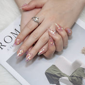 Transparent pink press-ons with 3D lollipop, star accents, and sparkly confetti