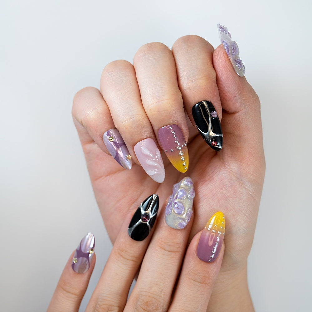 Luxury almond-shaped press-on nails with gradient, flowers, and crystals