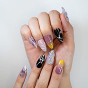 Luxury almond-shaped press-on nails with gradient, flowers, and crystals