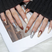 Handmade almond nails in brown ombre and silver sparkle accents