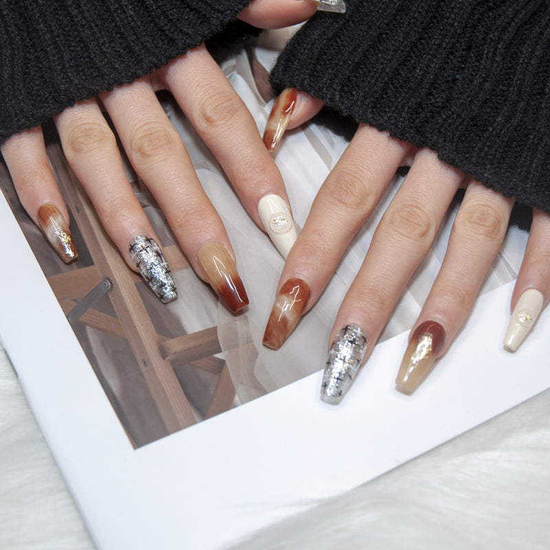 Handmade almond nails in brown ombre and silver sparkle accents