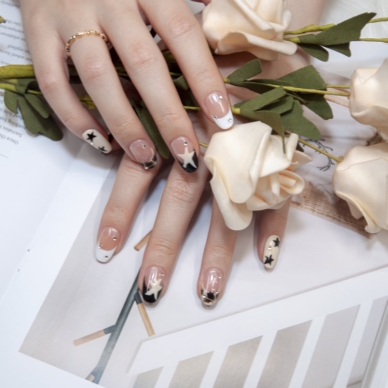 Minimalist star-themed press-on nails with crystal studs
