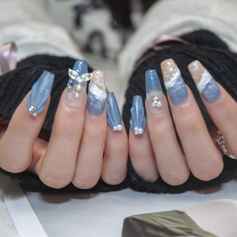 Hand-painted seaside nails with 3D wave texture and marine life art