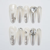 Luxury pearl white and silver nails with 3D crystals, perfect for bridal looks