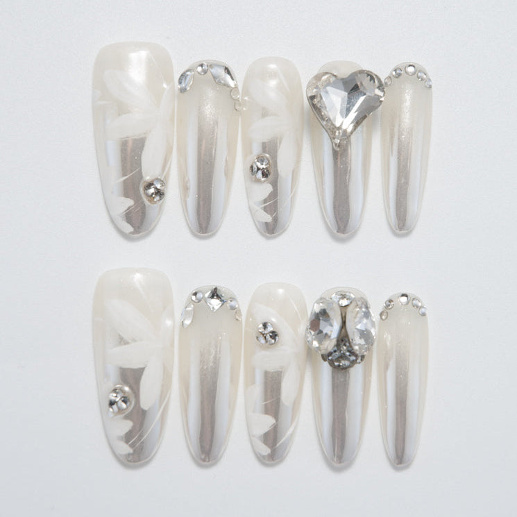 Luxury pearl white and silver nails with 3D crystals, perfect for bridal looks