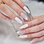 Classy French manicure press-on nails with soft nude tones and floral details