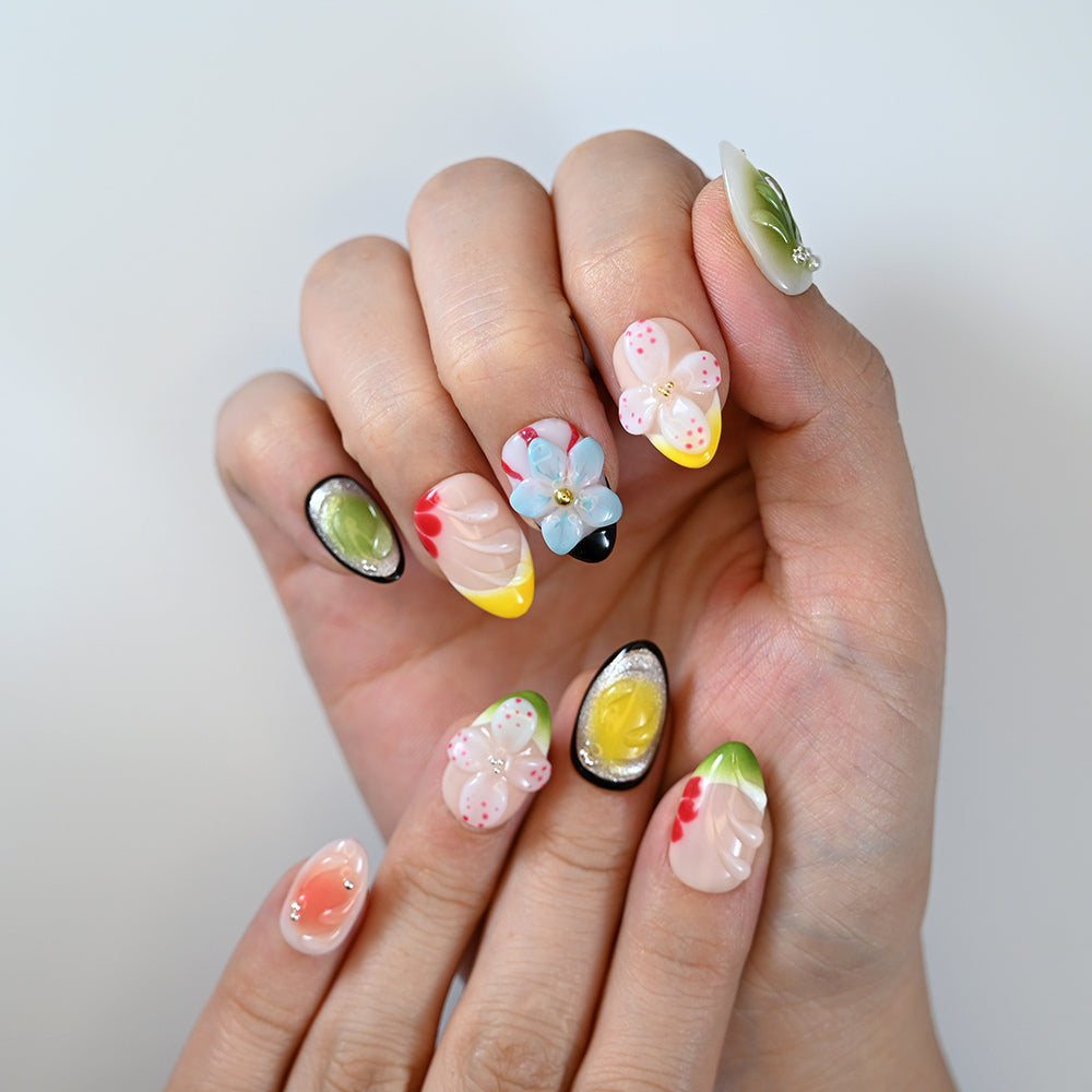 Playful multicolor nails with 3D blossoms, green and yellow accents by Charmeenail