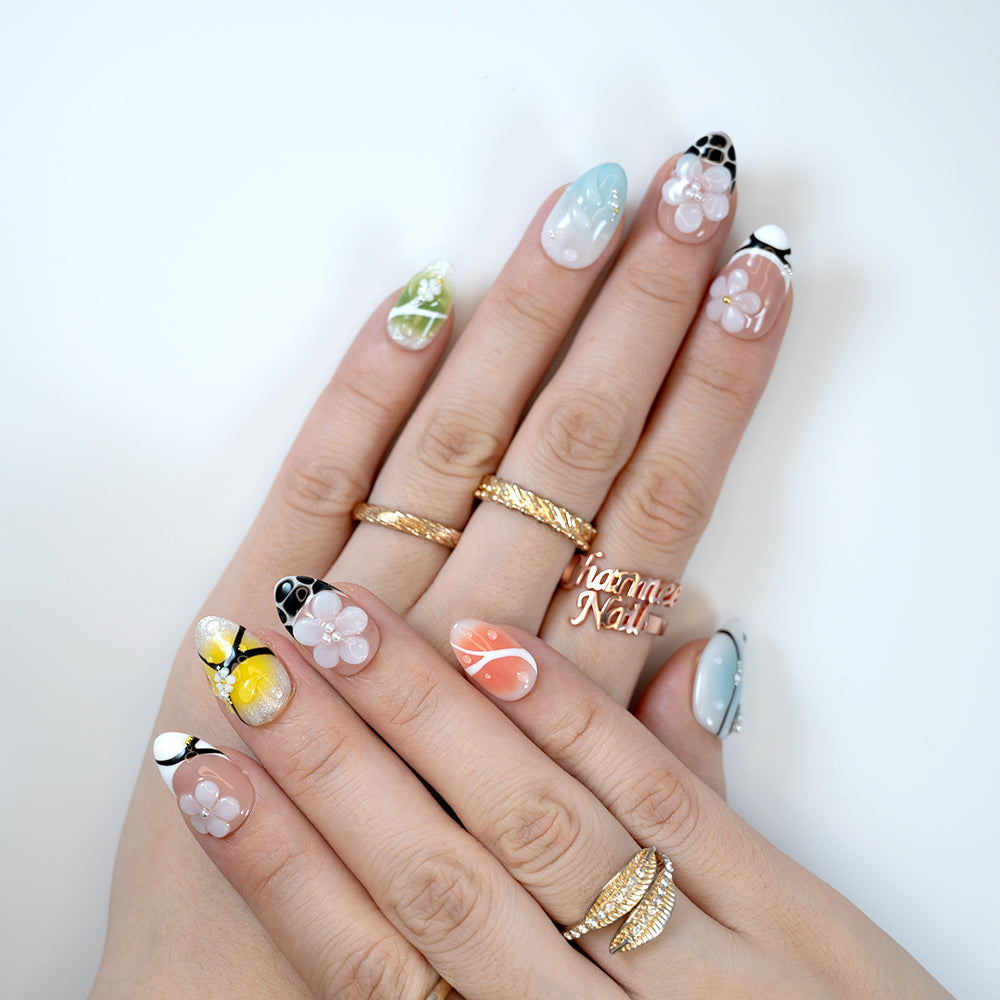  Handmade colorful nails with 3D blossoms, ombre tips, and glossy finish