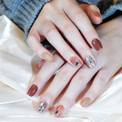 Handmade coffee and caramel tone nails with chunky glitter and 3D star designs