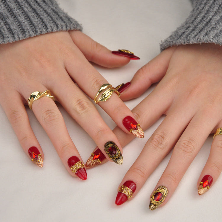 Elegant medieval-inspired nails with 3D jewel art and antique gold frames