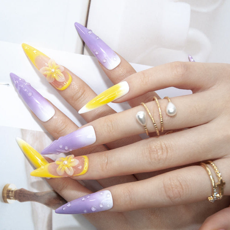Ombre lilac and yellow nails with polka dots and floral charm