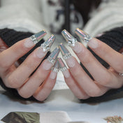 Handmade luxury press-on nails with iridescent chrome tips, pearls, and silver gems