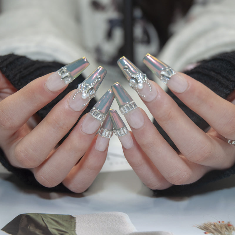Handmade luxury press-on nails with iridescent chrome tips, pearls, and silver gems
