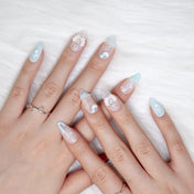 Cute kawaii style press-on nails with 3D paw, bow, pearls, and heart embellishments