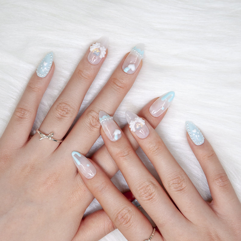 Cute kawaii style press-on nails with 3D paw, bow, pearls, and heart embellishments