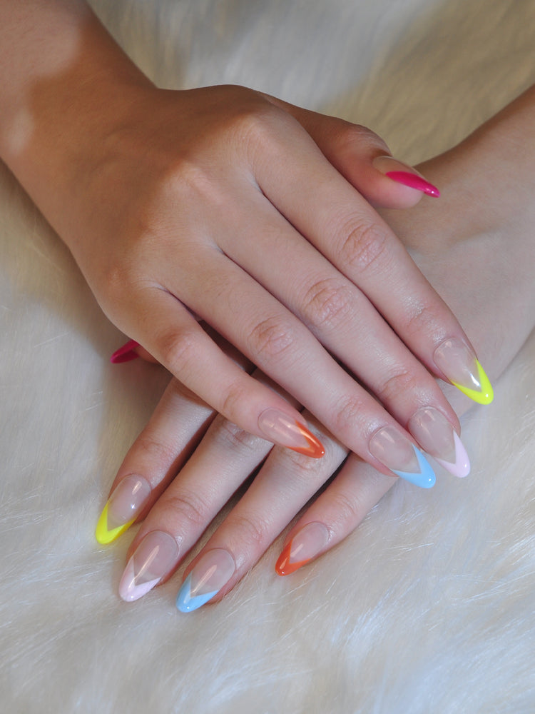 V-shaped multicolor French tip press-on nails in glossy almond shape