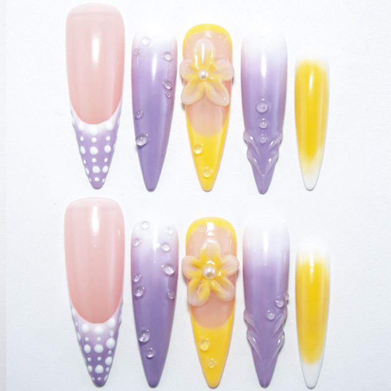 Purple and yellow press-on nails with 3D flower and water droplet details