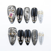 Black and white marble press-on nails with gold and silver rhinestone accents