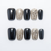 Black and gold glitter press-on nails with clear leaf pattern accent