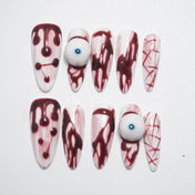 Halloween press-on nails with 3D eyeball and bloody drip design
