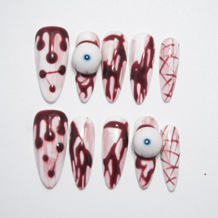 Halloween press-on nails with 3D eyeball and bloody drip design