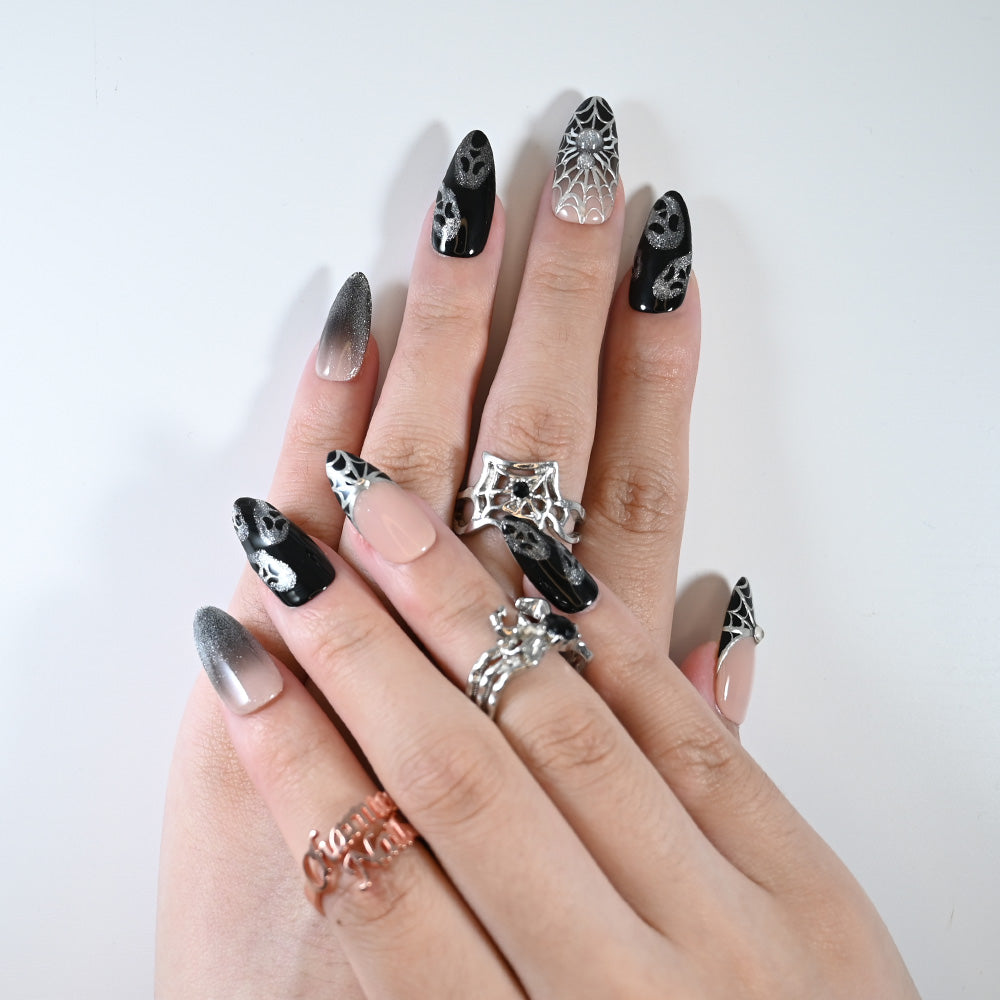 Charmeenail acrylic nails featuring spooky gothic spider details and shimmer