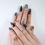 Charmeenail acrylic nails featuring spooky gothic spider details and shimmer