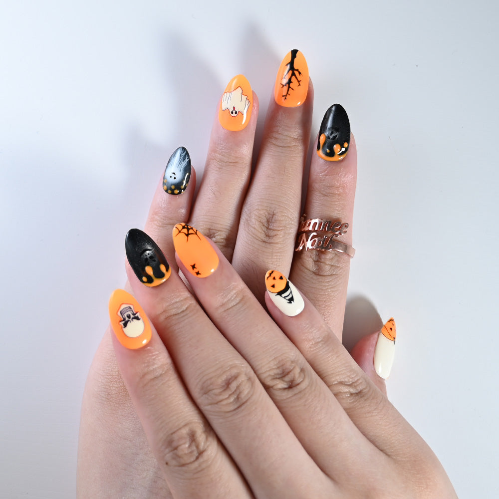 Salon quality Halloween press on nails in orange black with skull and pumpkin design