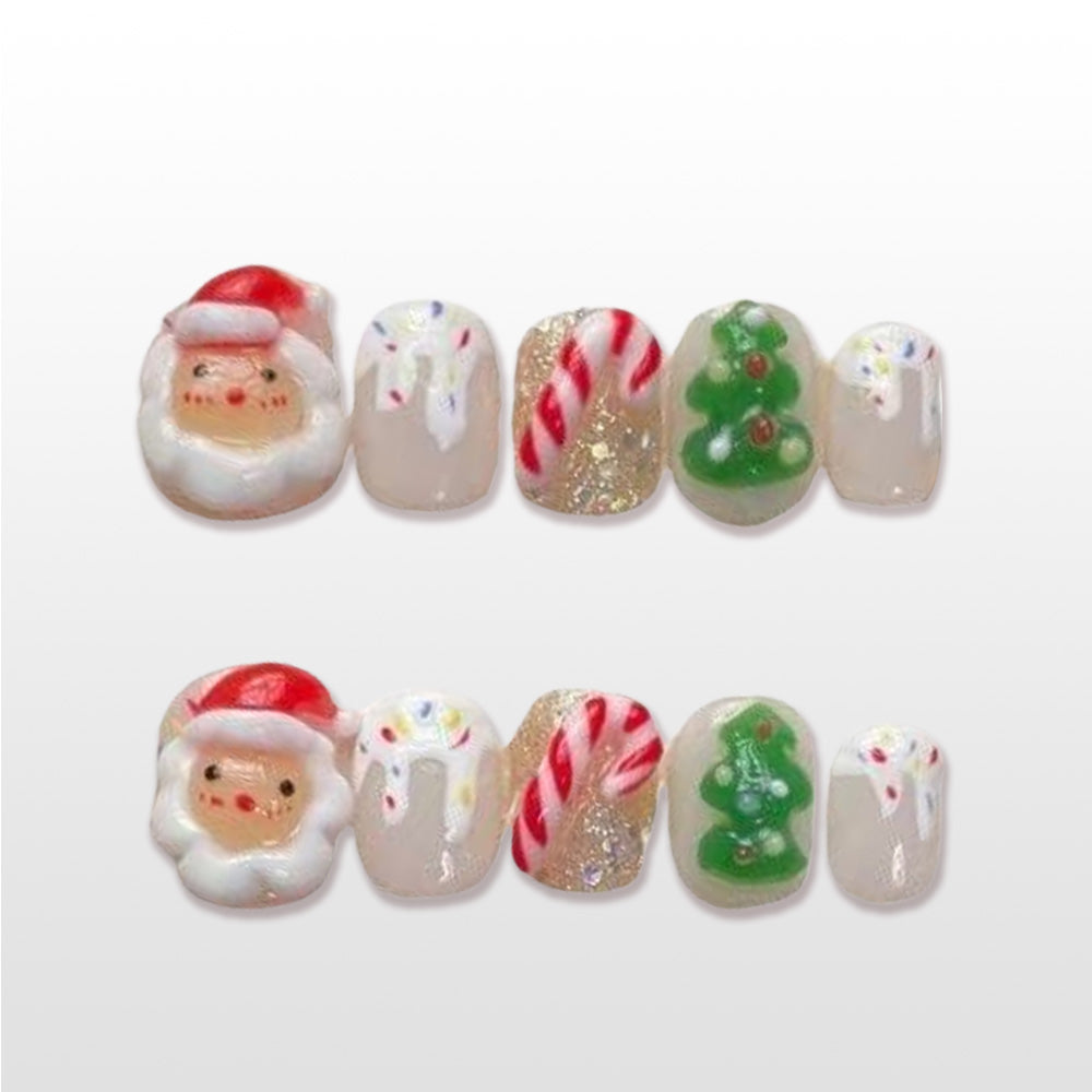Festive holiday nails with Christmas tree, glitter, and snow accents