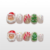 Festive holiday nails with Christmas tree, glitter, and snow accents