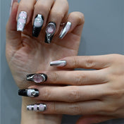 Edgy chrome nails with gradient ombre, silver 3D frames, and glitter stone details