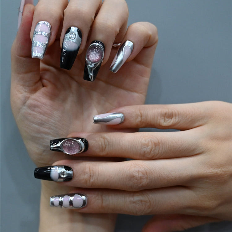 Edgy chrome nails with gradient ombre, silver 3D frames, and glitter stone details