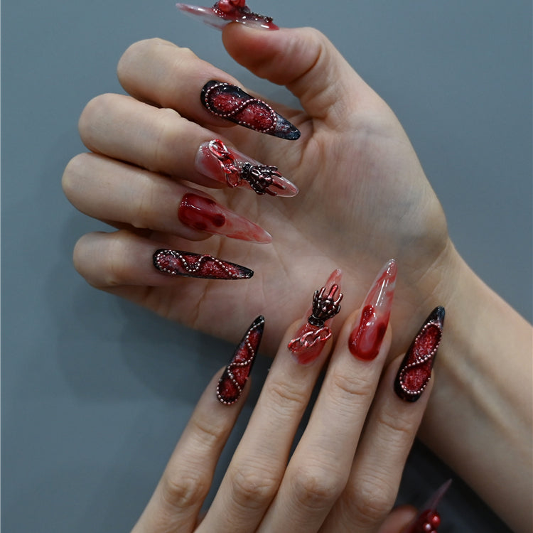 Long stiletto handmade nails with 3D rose, chain, and skull accents